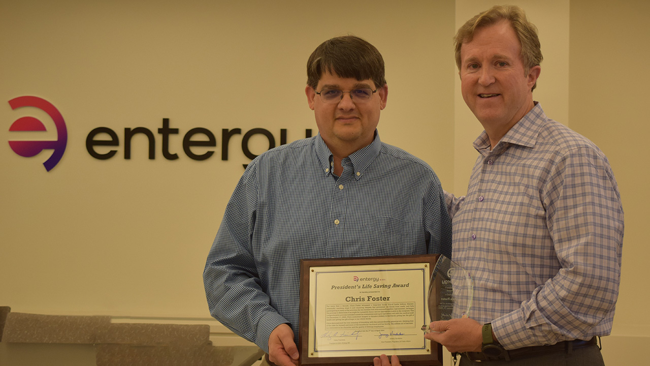Entergy Mississippi president and CEO Haley Fisackerly (right) presents the President's Life Saving Award to Chris Foster during a meeting held recently in Jackson..
